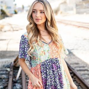 New Mint/Coral Ditsy Floral Flutter Sleeve. Fit and flair dress with pockets.